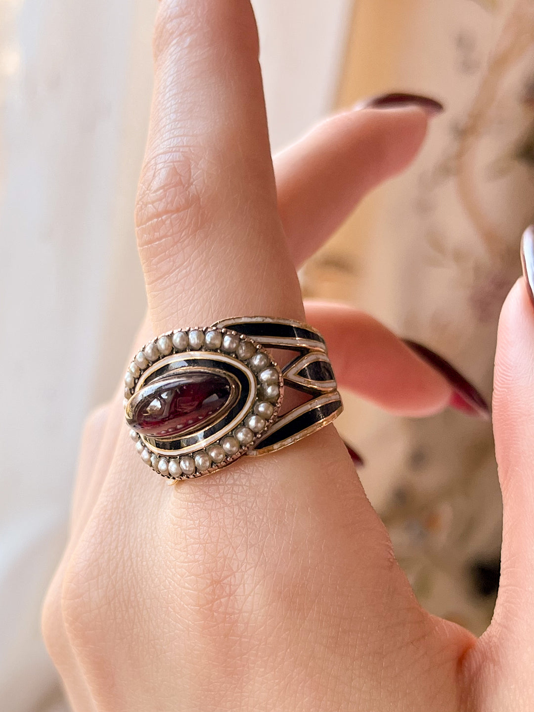 Outstanding Black and White Enamel Memorial Ring with Garnet Cabochon
