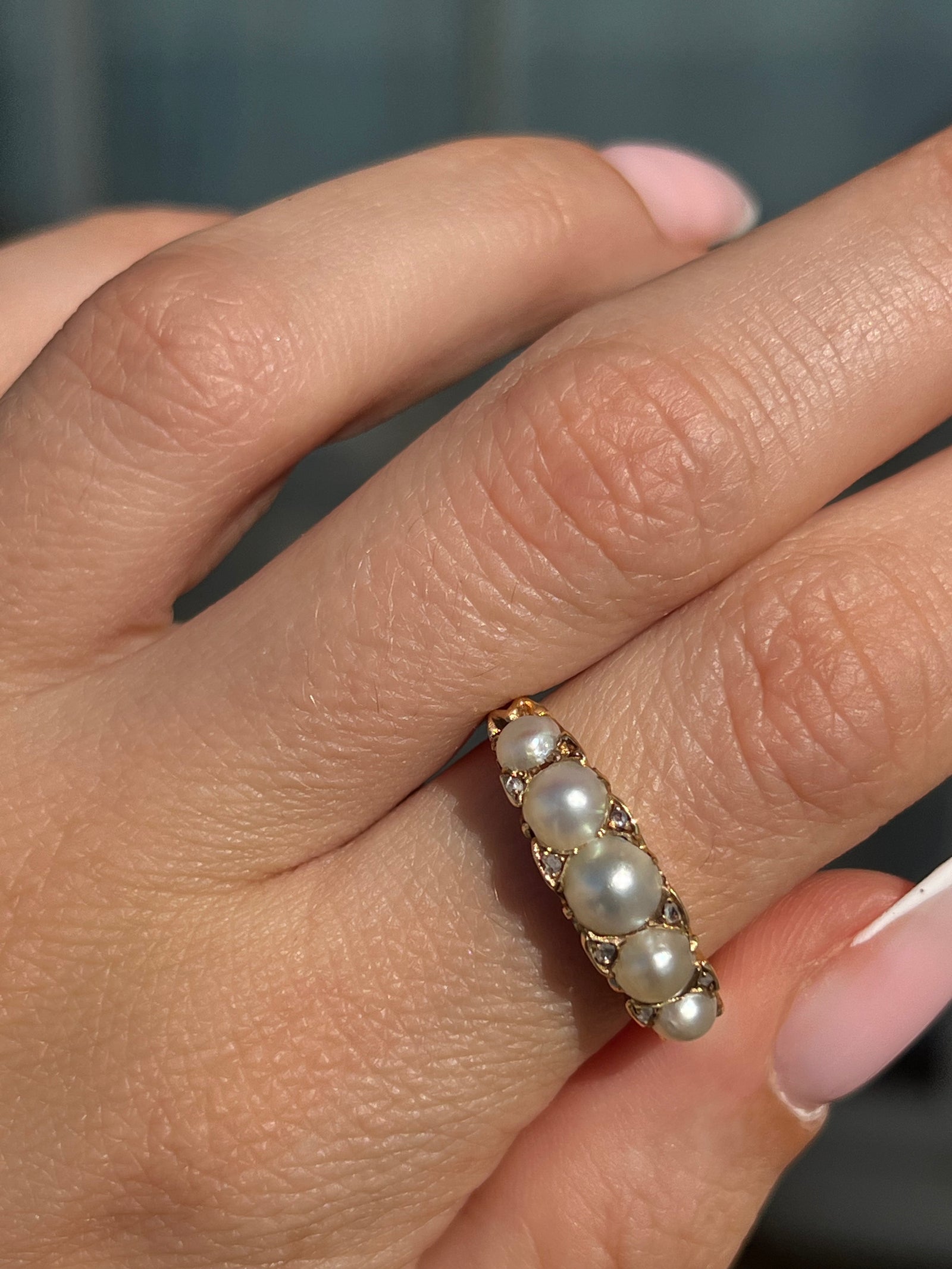 Victorian pearl and diamond band from circa 1890 with ornate fairytale-style gallery design