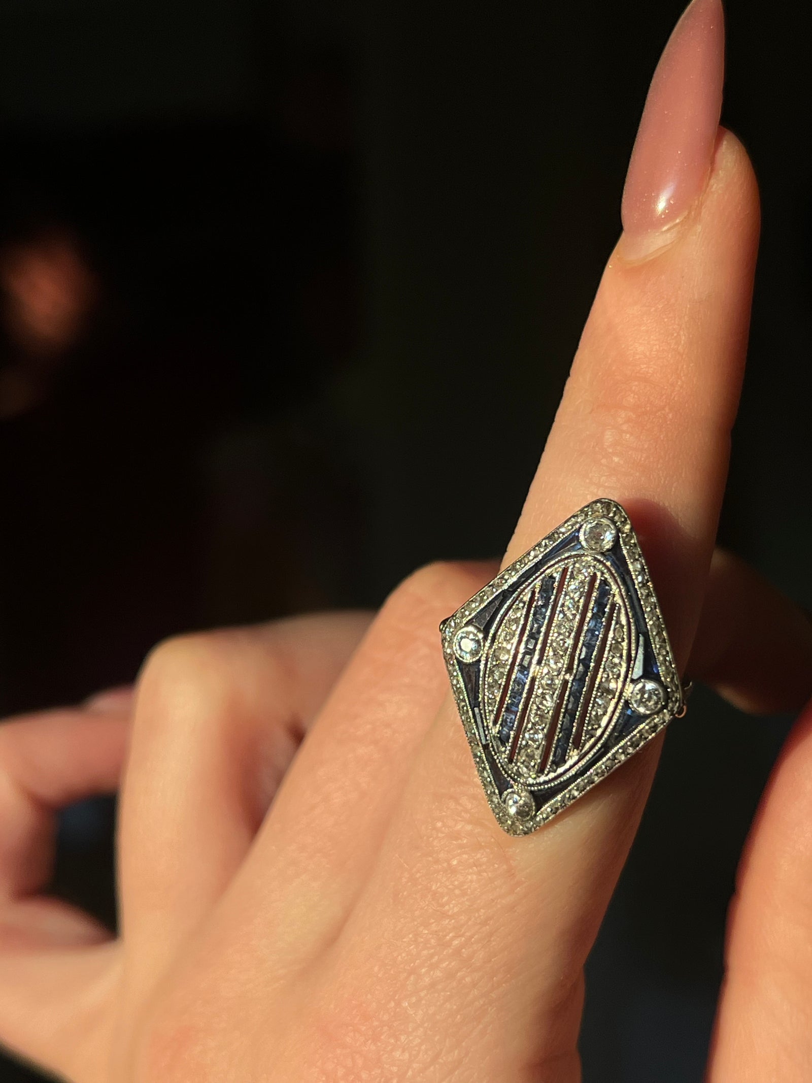 Art Deco platinum cocktail ring with diamonds and sapphires in geometric design