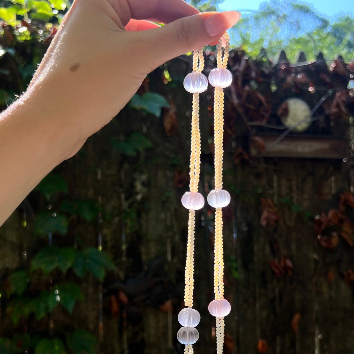 Eloise Resort Collection carved rose quartz necklace featuring hand-carved rose quartz beads with soft pink tones and elegant resort-style design.