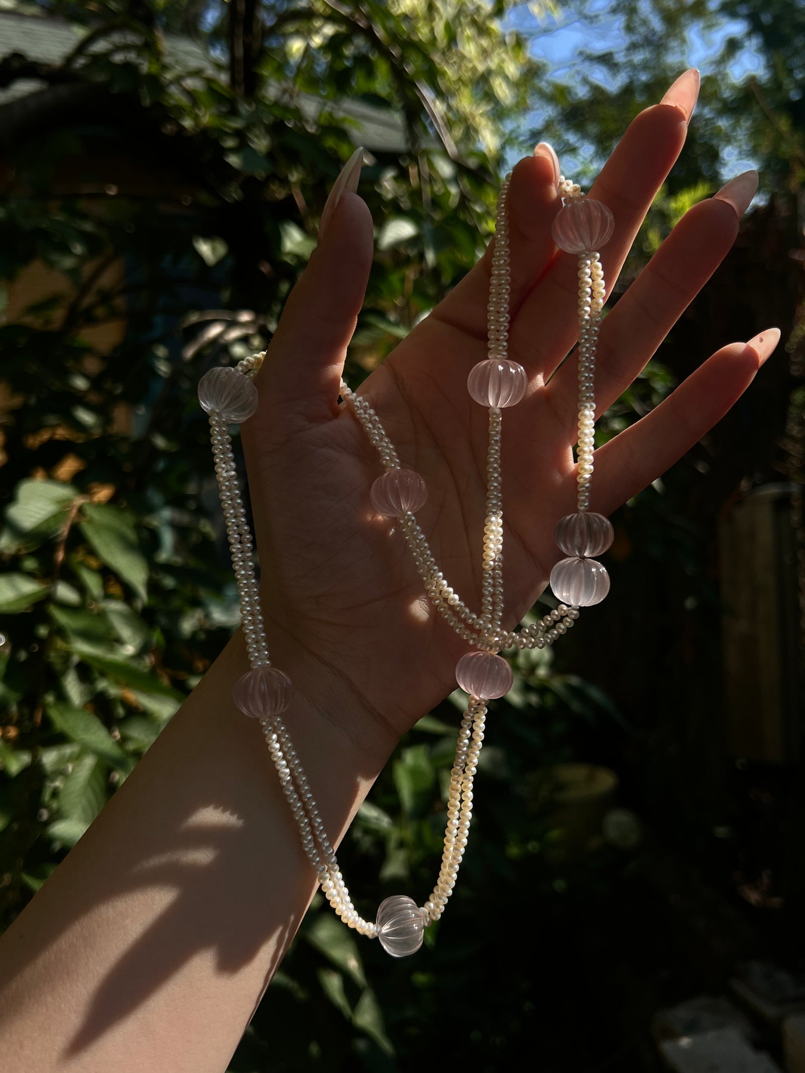 Eloise Resort Collection carved rose quartz necklace featuring hand-carved rose quartz beads with soft pink tones and elegant resort-style design.