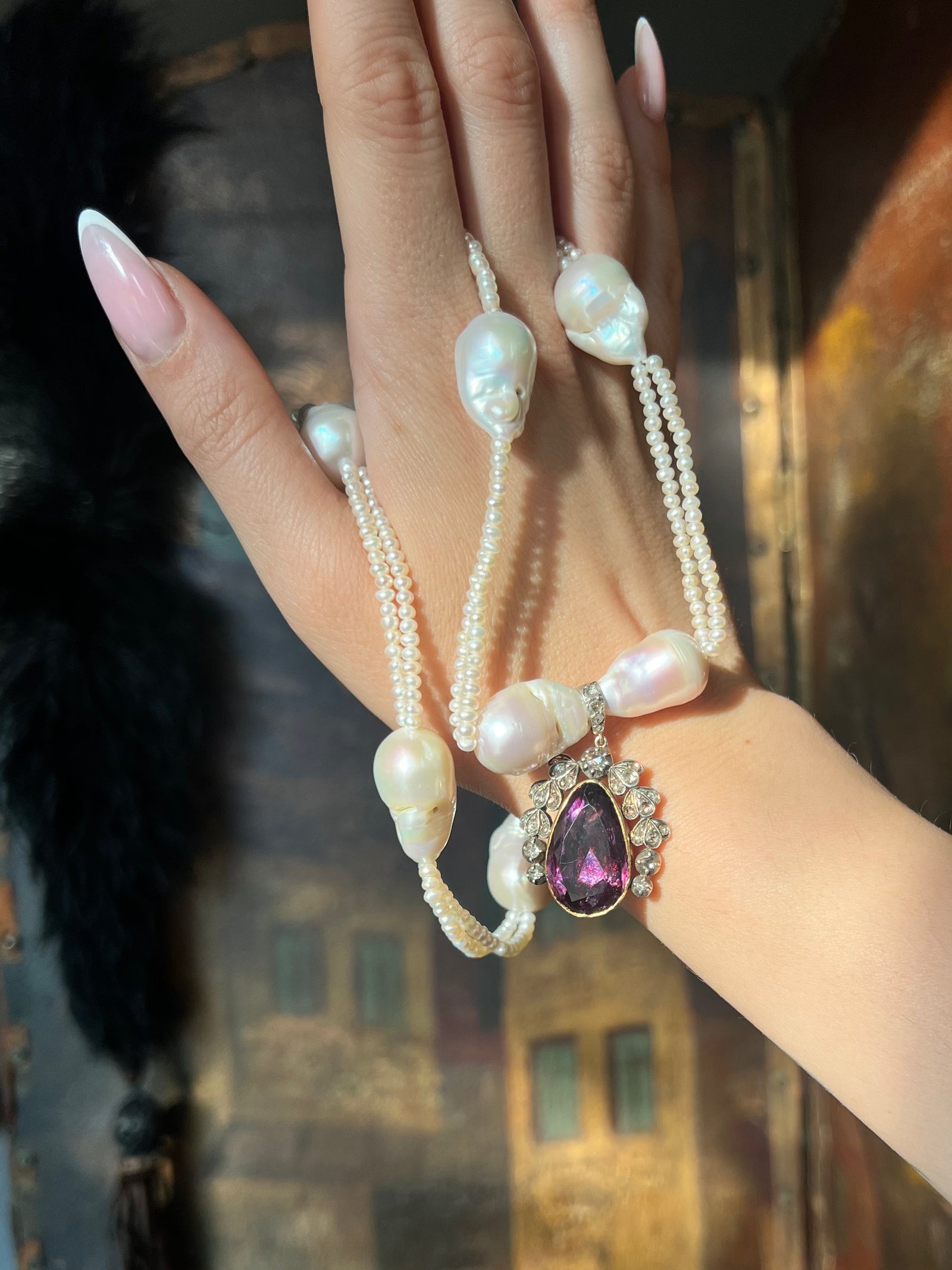 Victorian foiled amethyst and diamond locket from circa 1870 with ornate gold setting