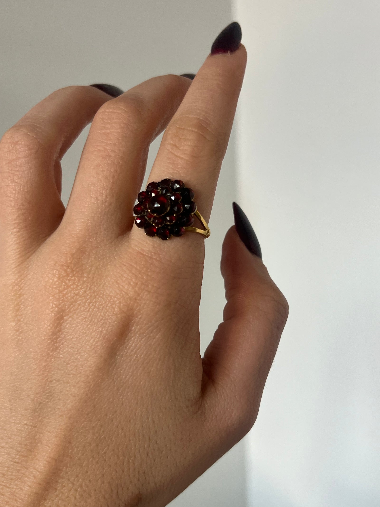 Antique c.1880 garnet cluster ring with richly faceted red garnets in ornate gold setting