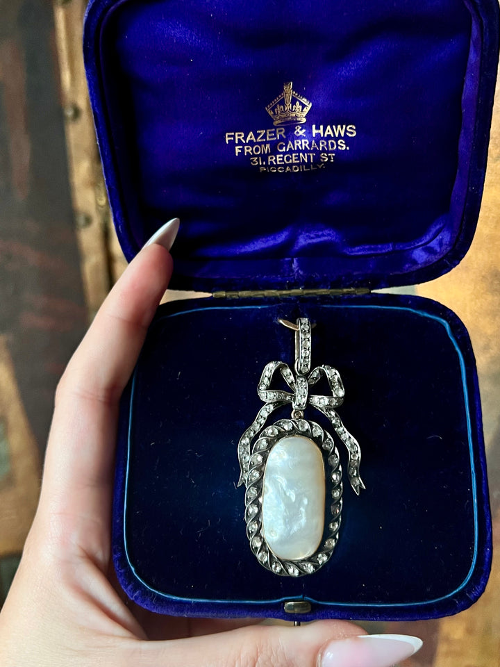 Diamond and Mother-of-Pearl Bow Pendant in Box C. 1905