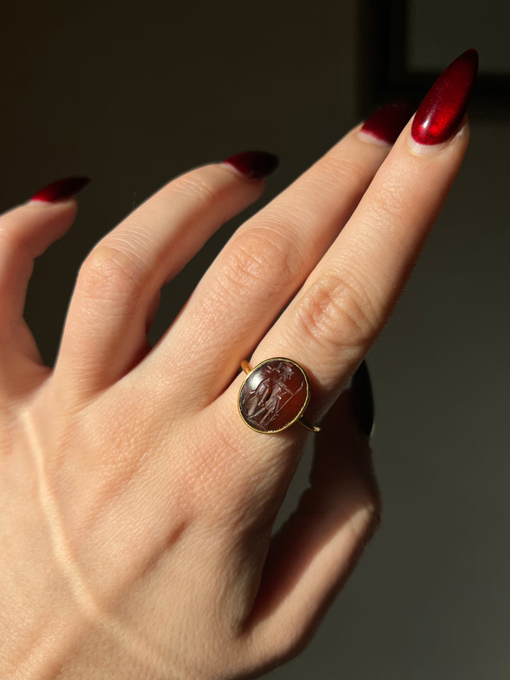 Superb 2nd Century CE Dark Carnelian Intaglio of Soldier Preparing for Battle in 18ct Ring