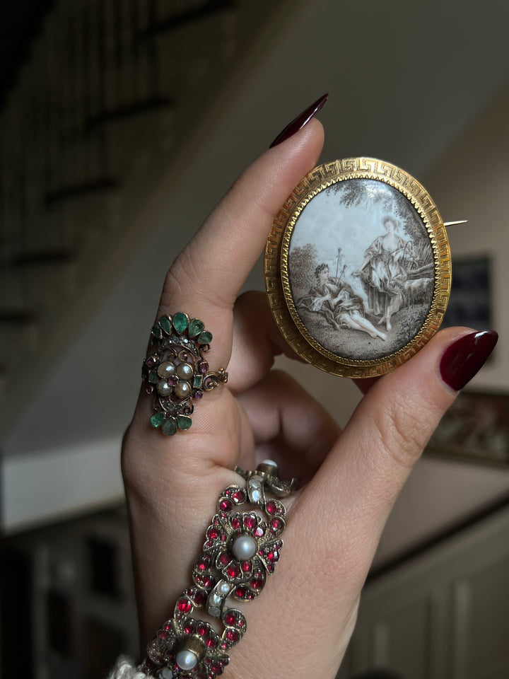French pastoral enamel brooch in grisaille technique with detailed 19th-century scenic design