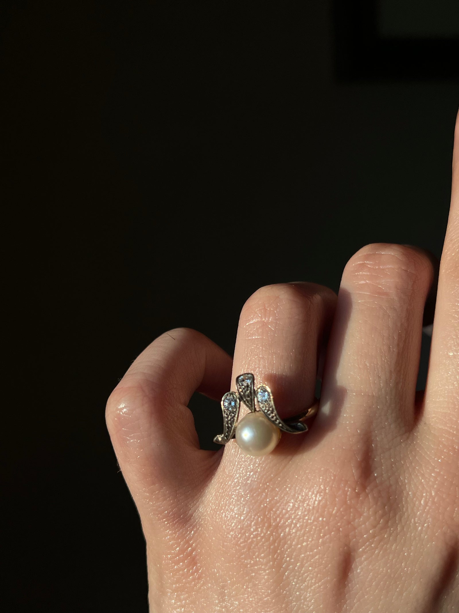 Elegant pearl and diamond waterfall ring with cascading vintage design