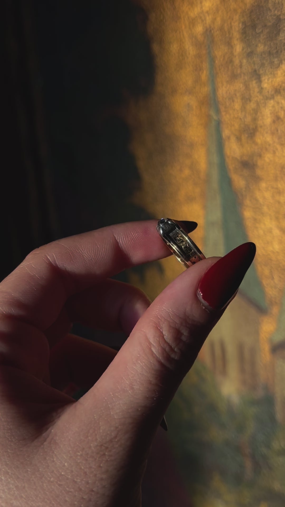 18ct gold mourning ring featuring a prominent old cut diamond in antique design