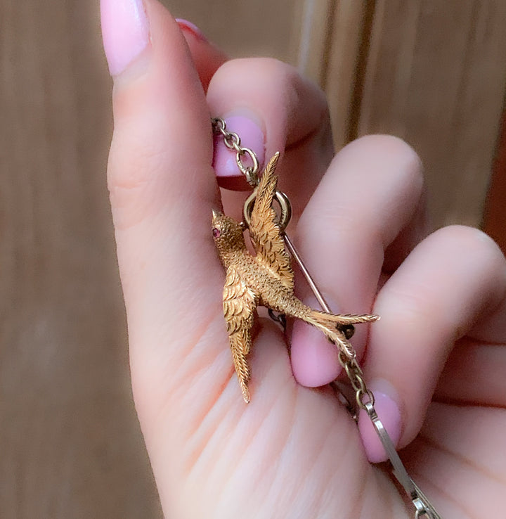Stunning Swallow Brooch in 15k with a Ruby Eye *include green ribbon*