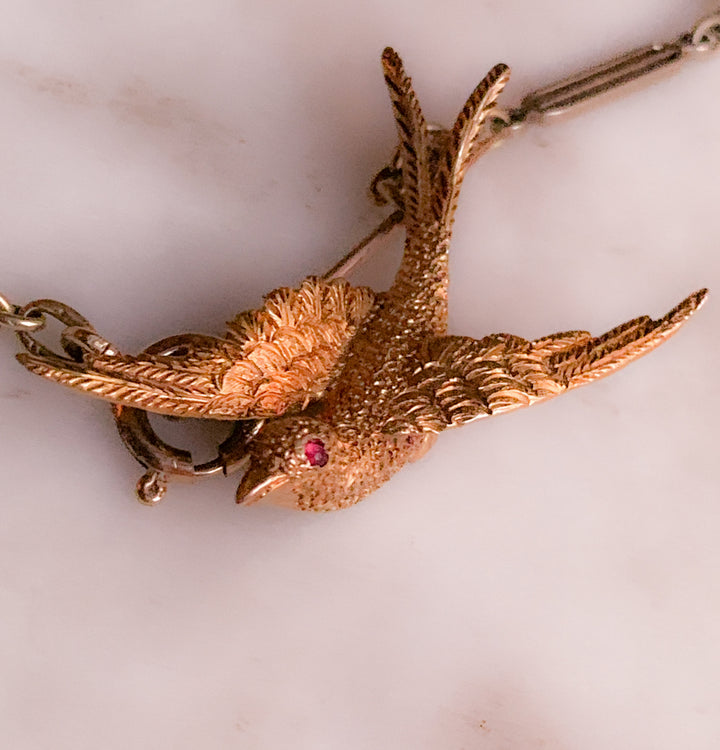 Stunning Swallow Brooch in 15k with a Ruby Eye *include green ribbon*