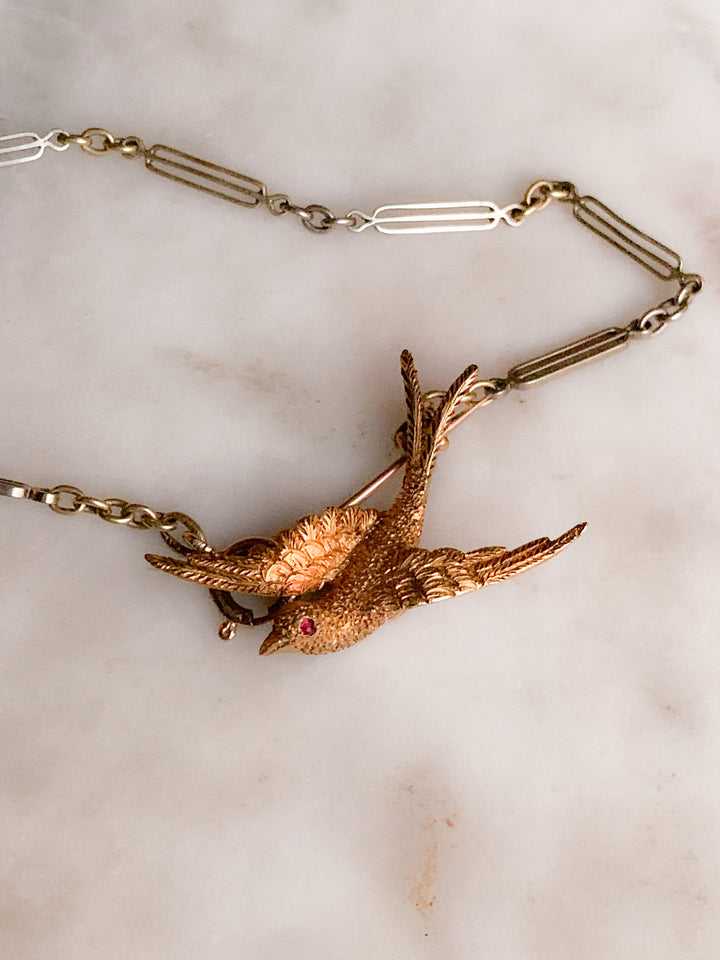 Stunning Swallow Brooch in 15k with a Ruby Eye *include green ribbon*